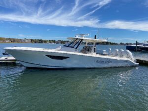 2022 Pursuit S 378 Sport 40-foot center console yacht profile view showing hardtop, helm station, and outboard engines in ...