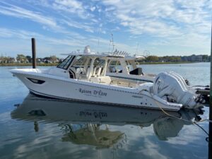 Bow view of 2022 Pursuit S 378 Sport center console with forward seating and windshield.