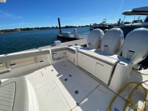 Pursuit S 378 Sport cabin berth with upholstered seating and interior lighting in 40-foot sport yacht.