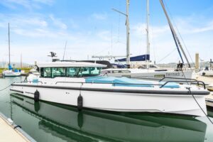 2023 Axopar 37 XC cross cabin cruiser with hardtop and full helm station viewed from starboard profile in Anacortes, Washi...