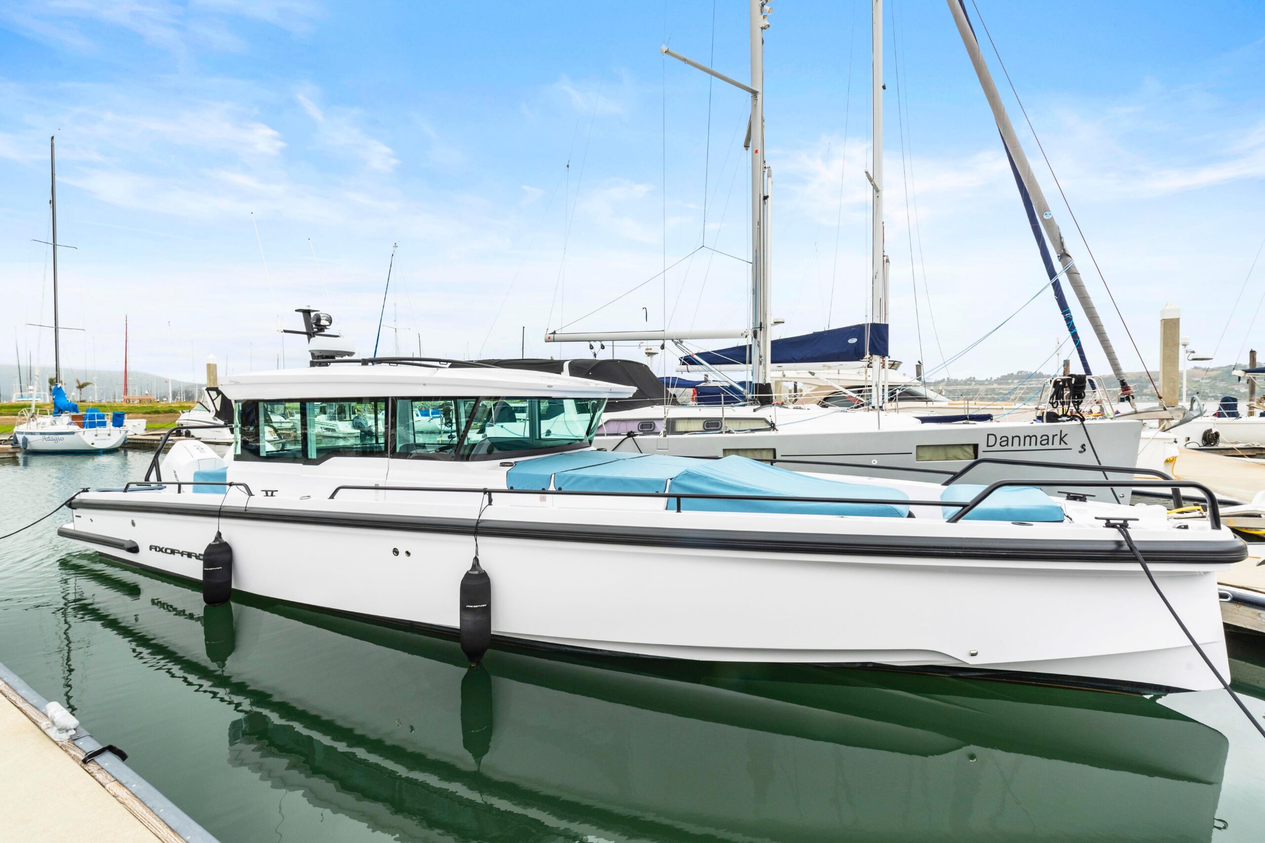2023 Axopar 37 XC cross cabin cruiser with hardtop and full helm station viewed from starboard profile in Anacortes, Washi...