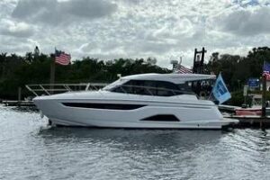 2023 Bavaria R40 Coupe hardtop salon with forward-facing seating, curved windows, and natural light from cabin ports.