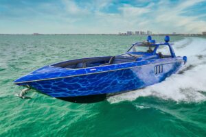 2023 Cigarette 59 Tirranna running profile starboard side showing stepped hull design, twin outboard engines, and hardtop ...