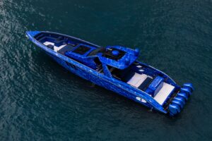 Cigarette 59 Tirranna helm station with dual Garmin displays, leather helm seating, and forward visibility to the bow.