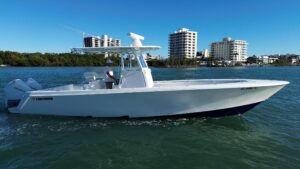 Bow view of 2023 Contender 32 ST center console with forward seating and windshield, Tequesta, Florida.