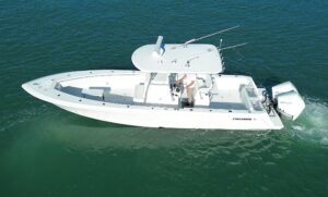 Contender 32 ST center console with bow seating, windshield, and hardtop viewed from starboard angle.