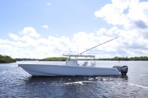 2023 Contender 44 ST center console profile with hardtop and outriggers in Stuart, Florida.