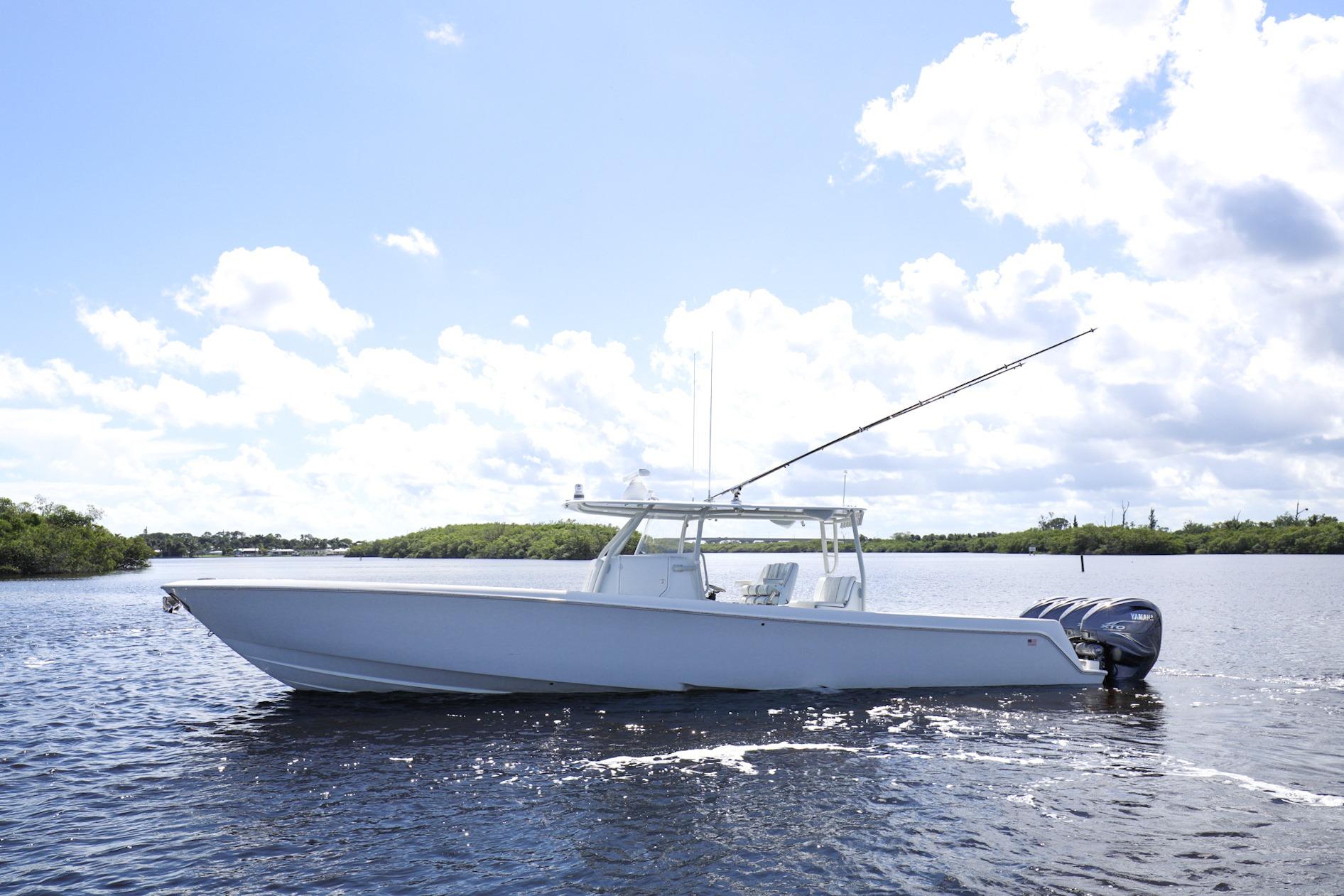 2023 Contender 44 ST center console profile with hardtop and outriggers in Stuart, Florida.