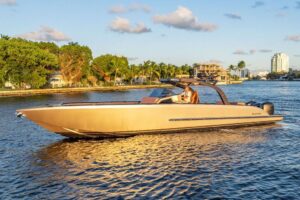 2023 De Koning 43 motor yacht starboard profile showing full exterior with hardtop and running strakes in Fort Lauderdale.