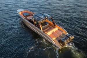 2023 De Koning 43 center console helm station with dual Garmin displays, steering wheel, and forward visibility over bow.