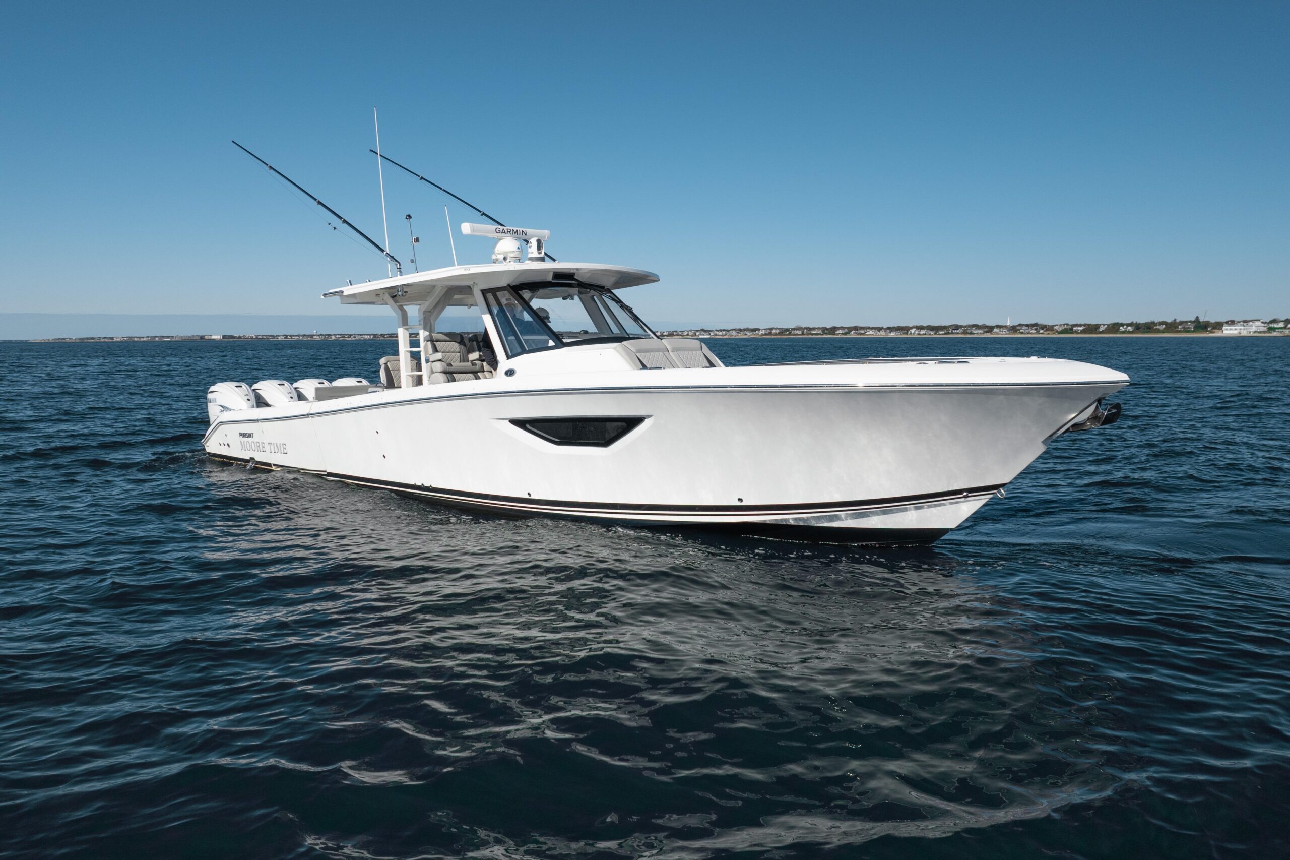 2023 Pursuit S 428 Sport 42-foot center console yacht with twin outboard engines shown in profile starboard view on the wa...