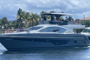 2023 Schaefer 660 center console helm station with dual Garmin displays, stainless steel wheel, and forward visibility ove...