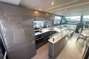 Schaefer 660 galley with stainless steel appliances, white cabinetry, and granite countertops in Deerfield Beach, Florida.