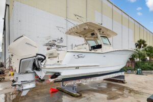 Bow seating and anchor locker on 2023 Scout 305 LXF center console fishing boat.