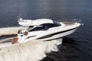 Bow view of 2024 Galeon 425 HTS with curved windscreen and forward seating area.