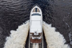 Galeon 425 HTS helm station with dual Garmin displays, leather helm seat, and forward visibility through windscreen.