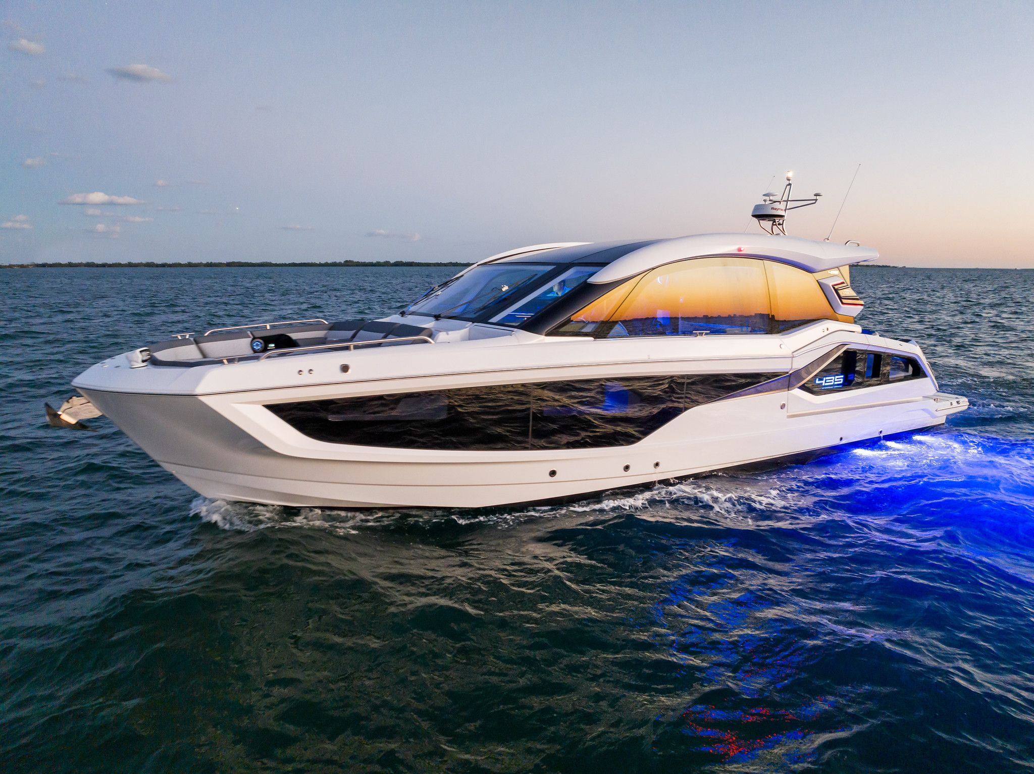 2024 Galeon 435 GTO 43-foot motor yacht profile showing hardtop, windscreen, and dual helm stations with full beam cockpit...