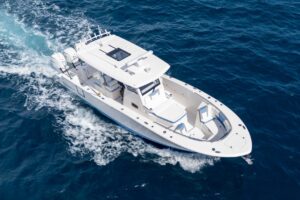 2024 Robalo R360 center console boat with bow seating and forward windshield viewed from above.