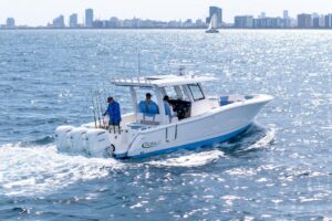 Bow seating and forward console of 2024 Robalo R360 center console with integrated helm station and windscreen.