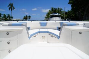 2024 Robalo R360 center console helm station with dual Garmin displays, stainless steel wheel, and forward visibility over...