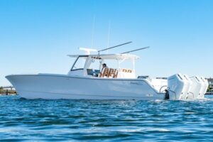 Helm station of 2025 Front Runner 43 catamaran with dual helm seats, steering wheel, and integrated Garmin electronics dis...