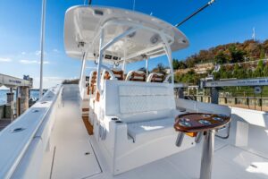 Starboard side view of 2025 Front Runner 43 catamaran showing dual hulls, hardtop, and cabin profile at Atlantic Highlands...