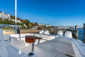 2025 Front Runner 43 catamaran helm station with dual helm seats, center console steering, and forward visibility through ...