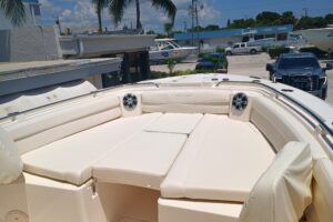 Grady-White Canyon 326 helm station with dual Garmin displays, center console steering, and forward visibility toward the ...