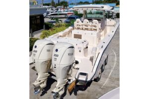 Grady-White Canyon 326 helm station with dual Garmin displays, center console steering, and forward visibility over bow.