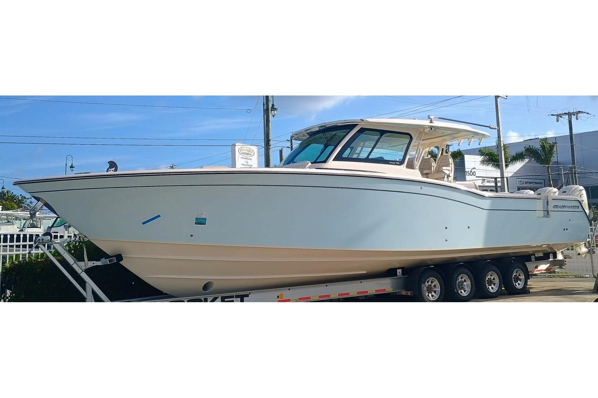 2025 Grady-White Canyon 456 center console fishing yacht with twin outboard engines, hardtop, and full helm station photog...