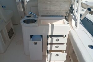 Grady-White Canyon 456 center console helm station with dual Garmin displays, stainless steel wheel, and forward visibilit...