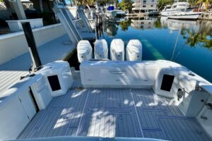 Intrepid 43 Nomad SE center console helm with dual Garmin displays, stainless steel wheel, and forward visibility over the...