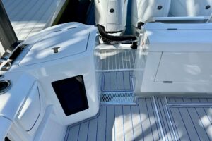 Intrepid 43 Nomad SE center console helm with dual Garmin displays and helm seating overlooking the bow.
