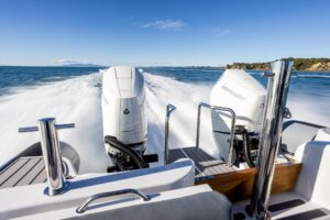 Protector 380 Targa helm station with dual Garmin displays and center console steering in 38.5-foot yacht.
