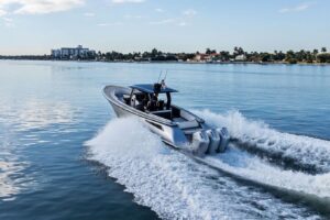 Wajer 38s bow seating area with forward-facing cushioned lounge and integrated storage on luxury 38-foot center console ya...