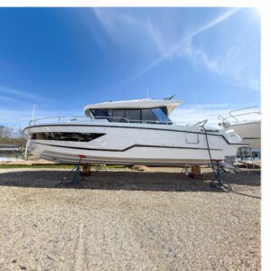 2025 Wellcraft 38 Explorer center console yacht with hardtop and twin outboard engines shown in profile on the water.