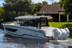 Wellcraft 38 Explorer bow seating area with forward cabin entry and windshield.