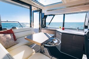 Wellcraft 38 Explorer helm station with dual Garmin displays, leather helm seat, and forward visibility through windshield.