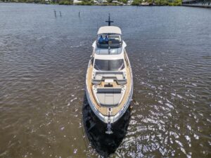 70-foot Azimut S7 luxury yacht salon with modern furnishings and expansive windows overlooking the water.