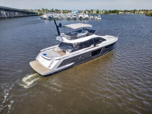 Azimut S7 70-foot luxury yacht salon with contemporary furnishings and large windows overlooking the water.
