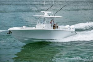 2026 Jupiter 32 center console boat with bow seating and windshield viewed from starboard side.