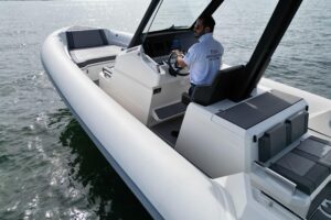 Northstar Orion 10 helm station with dual Garmin displays and center console steering in modern yacht cockpit.