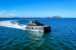 Sunreef 60 Power catamaran bow section with dual hulls and forward seating area in Miami Beach.
