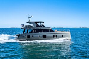 Sunreef 60 Power catamaran salon with panoramic windows, neutral upholstery, and modern interior design.