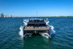 Sunreef 60 Power catamaran salon with contemporary seating, large windows, and open-plan living space.