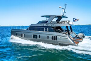 Sunreef 60 Power catamaran salon with dual helm stations and panoramic windows overlooking the water.