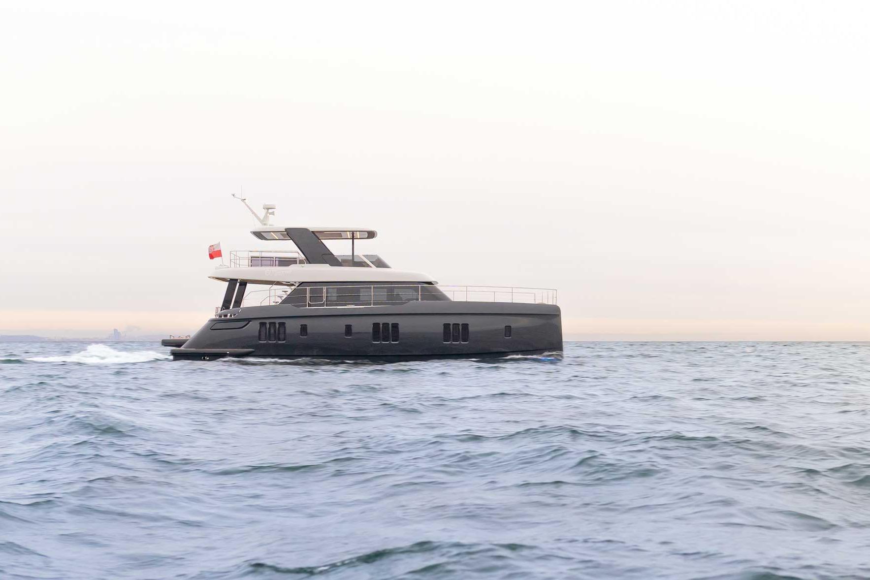 2026 Sunreef 60 Sunreef Power catamaran with dual hulls and hardtop, moored in Fort Lauderdale showing starboard profile a...