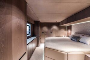 Sunreef 60 Power catamaran salon with contemporary seating, large windows, and open-plan living area.