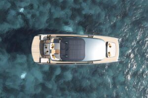 Sunreef 66 Ultima catamaran salon with contemporary seating, large windows, and open-plan living space.