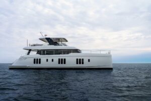 2026 Sunreef 70 Sunreef Power catamaran exterior profile starboard side view showcasing dual hulls and flybridge tower in ...